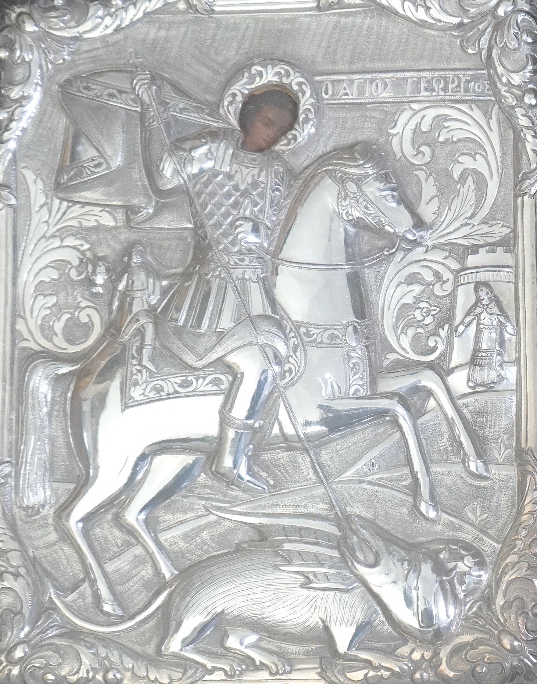 19th century Greek School , St George and the dragon, icon with silver oklad, 28 x 24cm